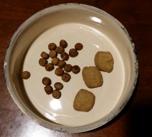 Average sized dog food is on the left, and the t/d food is the 3 large pieces on the right.