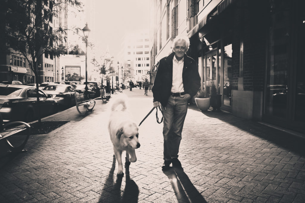 man walking dog
